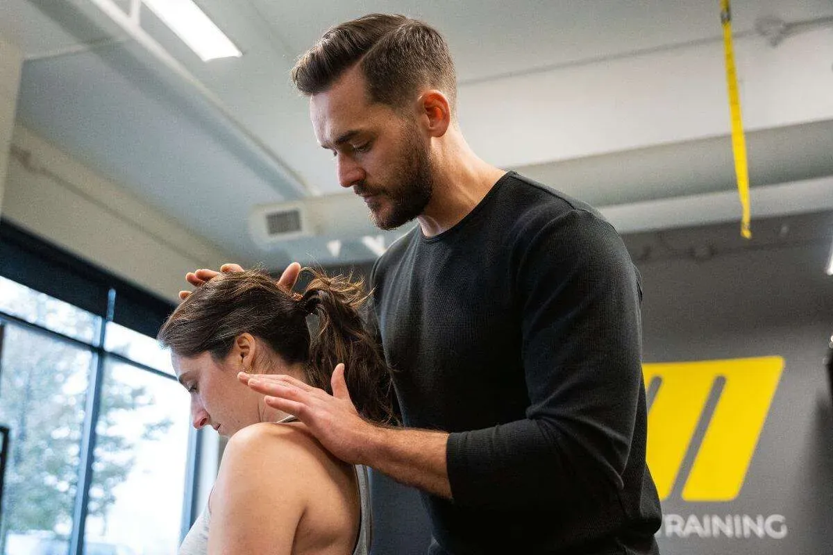 Brian performing neck controlled articular rotations (CARs) with a client