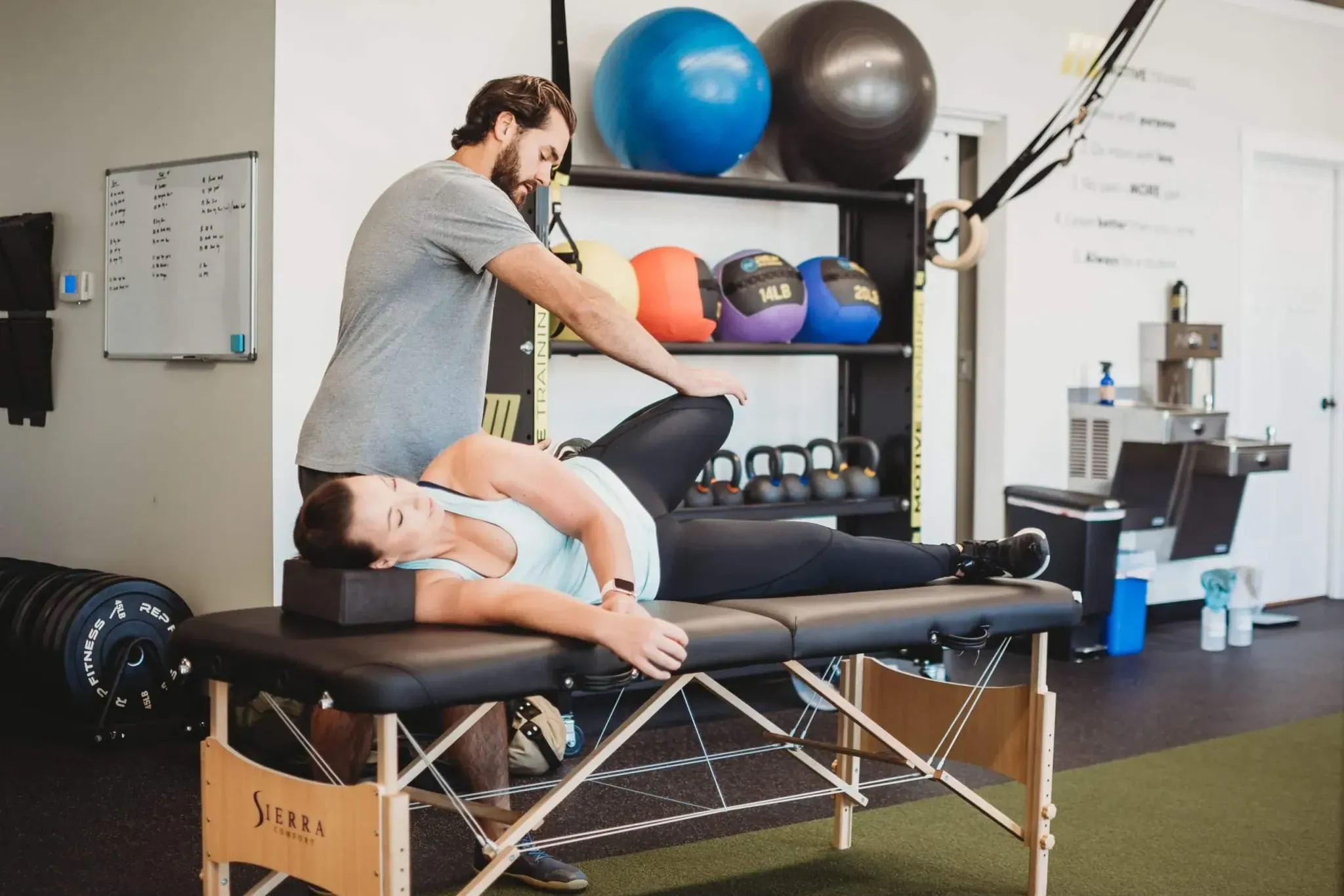 An experienced trainer testing range of motion